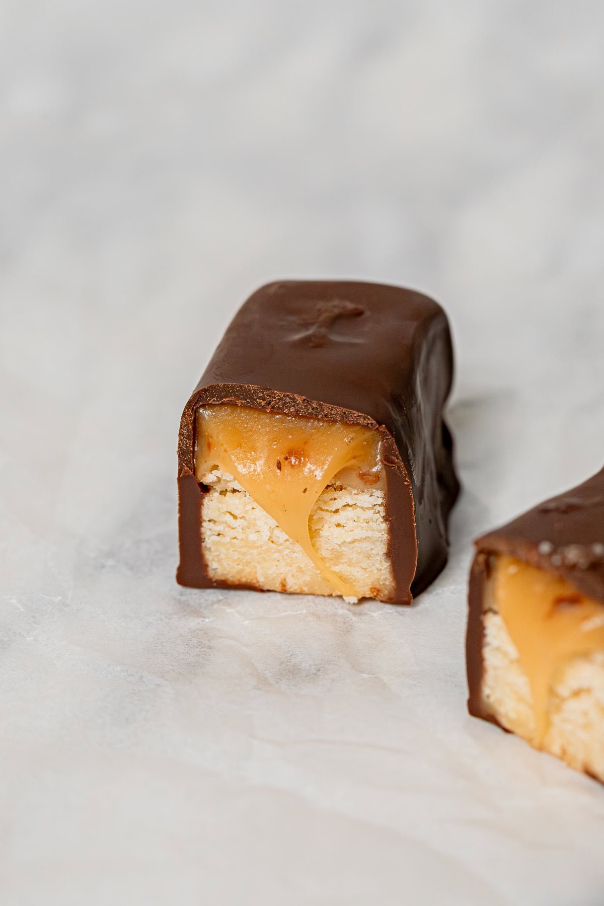 half Twix bar on parchment paper.