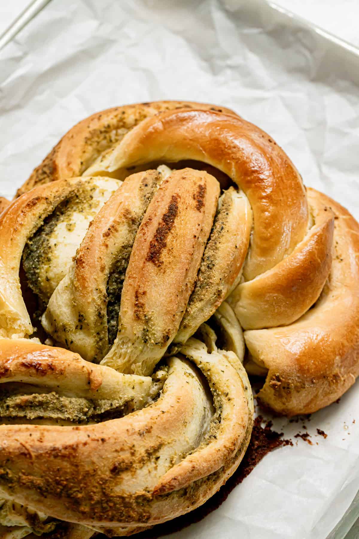 baked pesto bread on baking sheet.