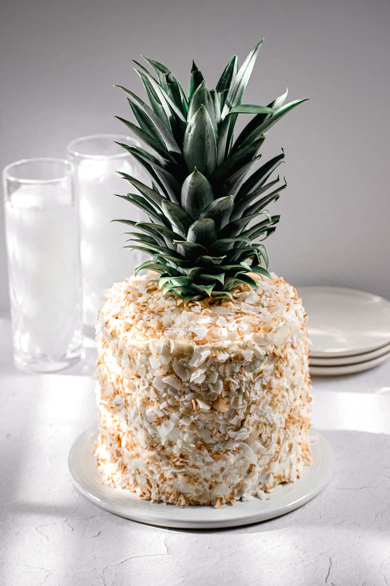piña colada cake with coconut swiss meringue buttercream.