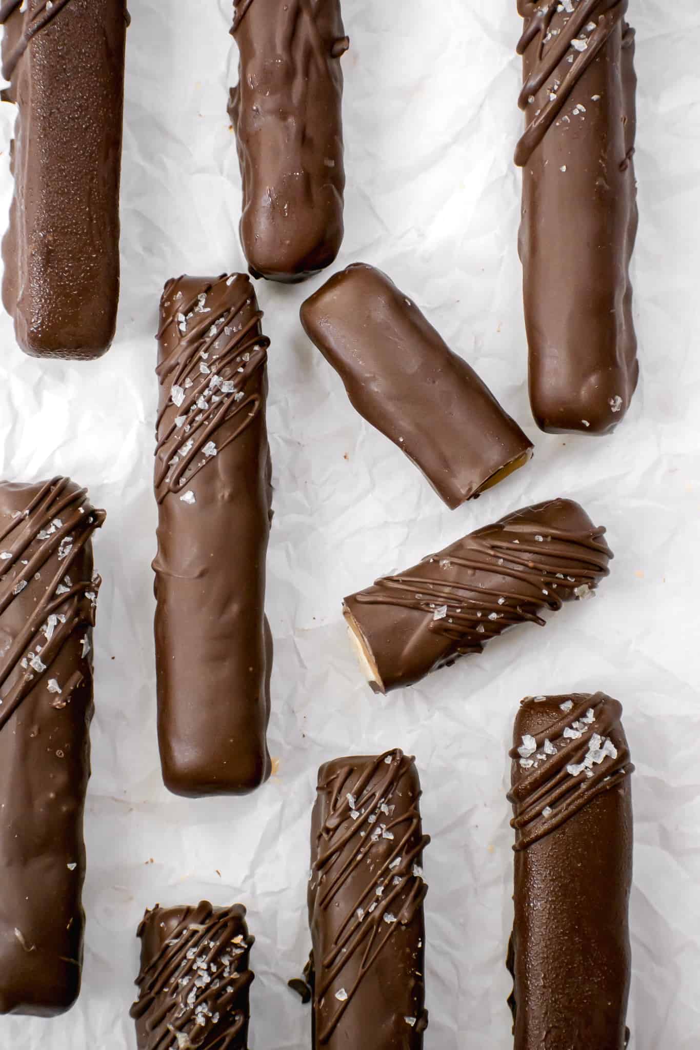 homemade twix bars on parchment paper.