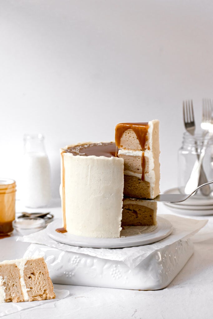 caramel layer cake with slice being taken out