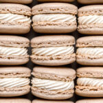 chai macarons with swiss meringue buttercream lined up
