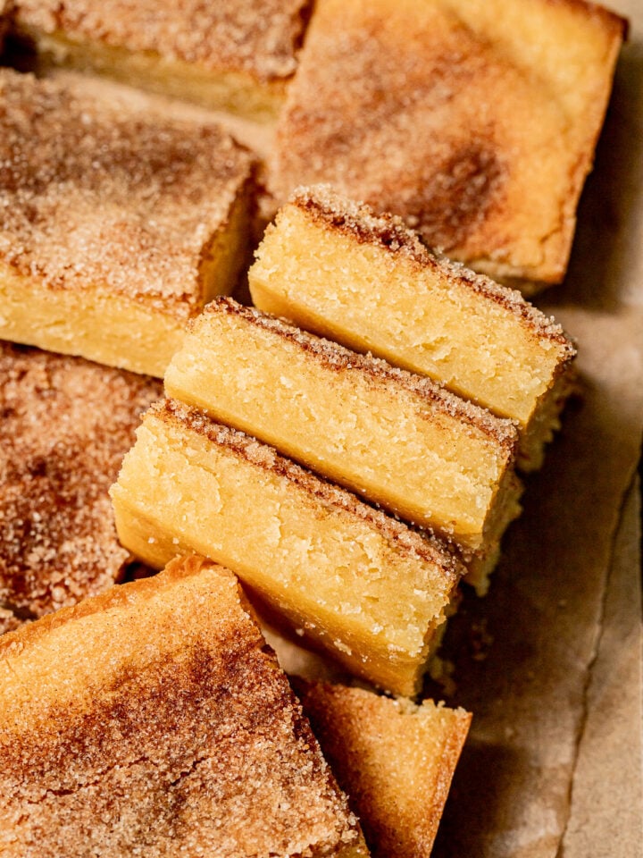 snickerdoodle cookie bars on parchment paper.