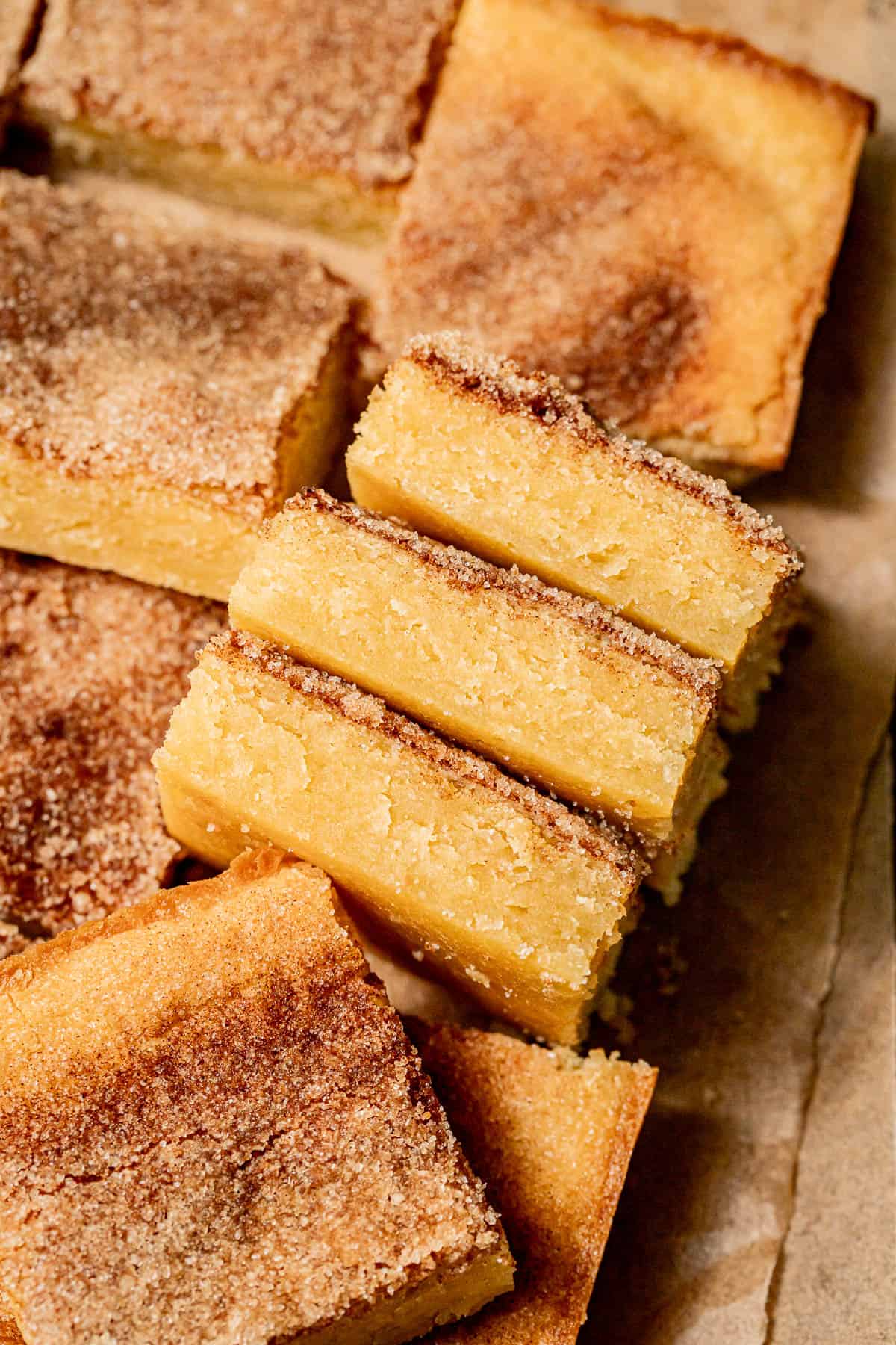 snickerdoodle cookie bars on parchment paper.