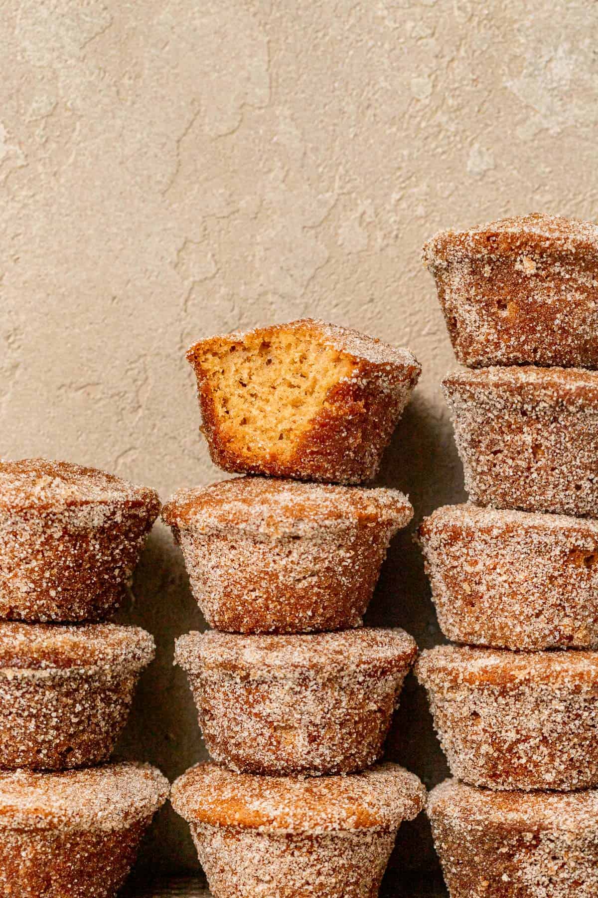 mini apple cider donut muffins stacked in three columns.