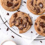 chocolate chip molasses cookies on round wire rack