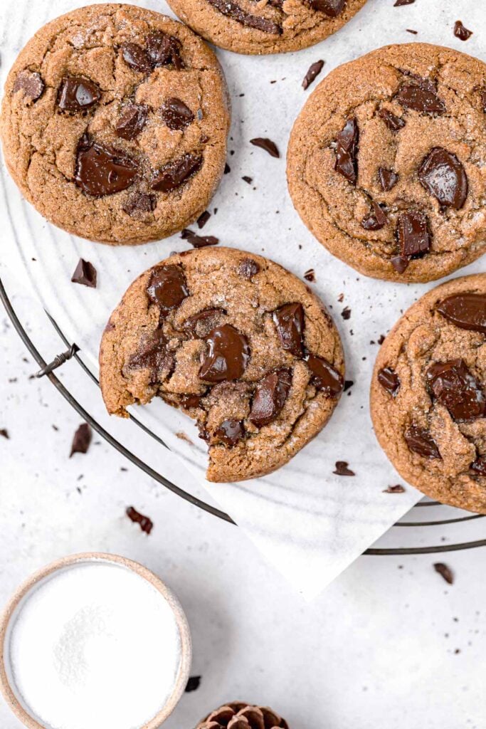 chocolate chip molasses cookies on round wire rack