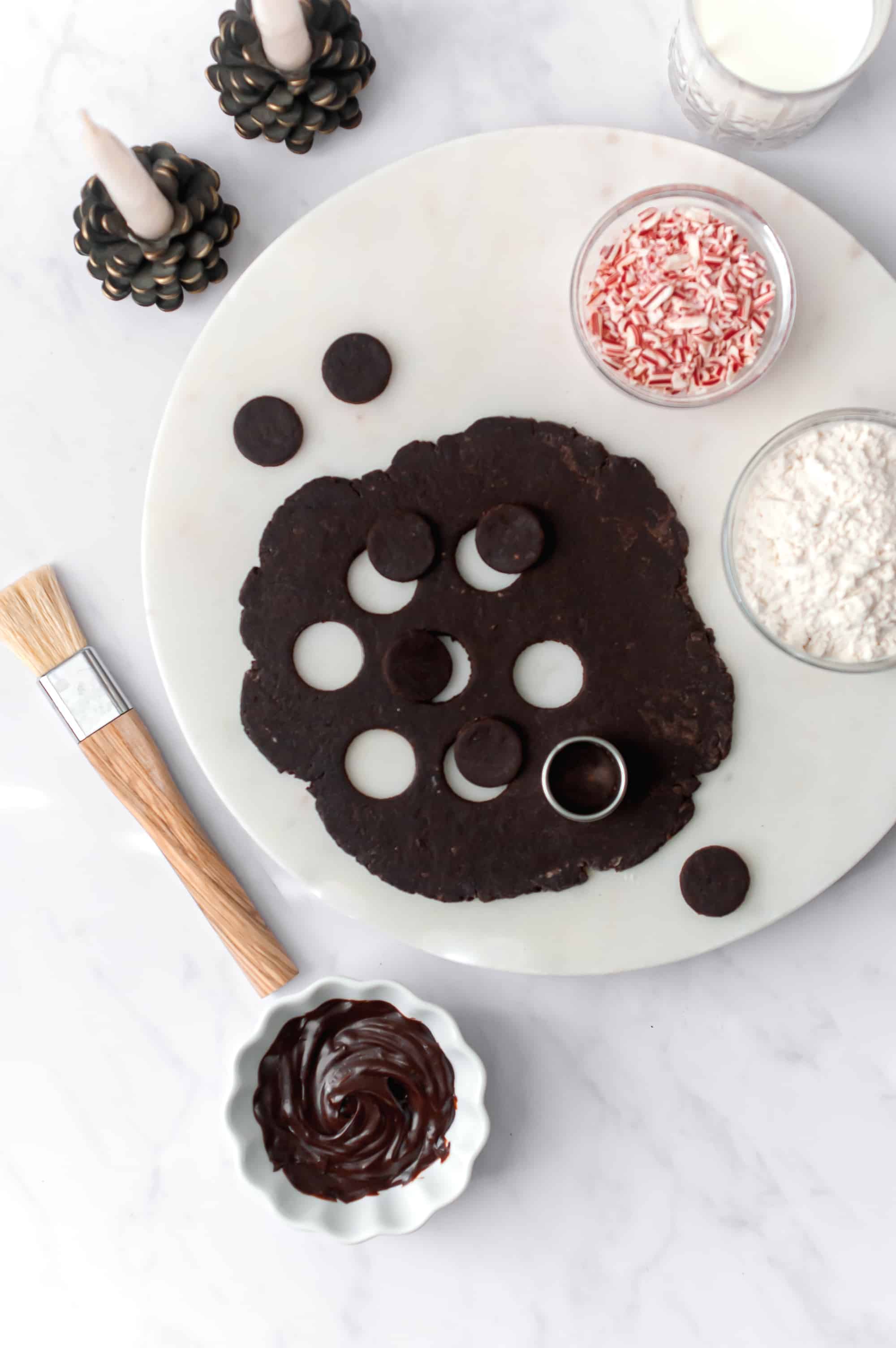 chocolate peppermint sable cookie dough rolled and cut into circles.