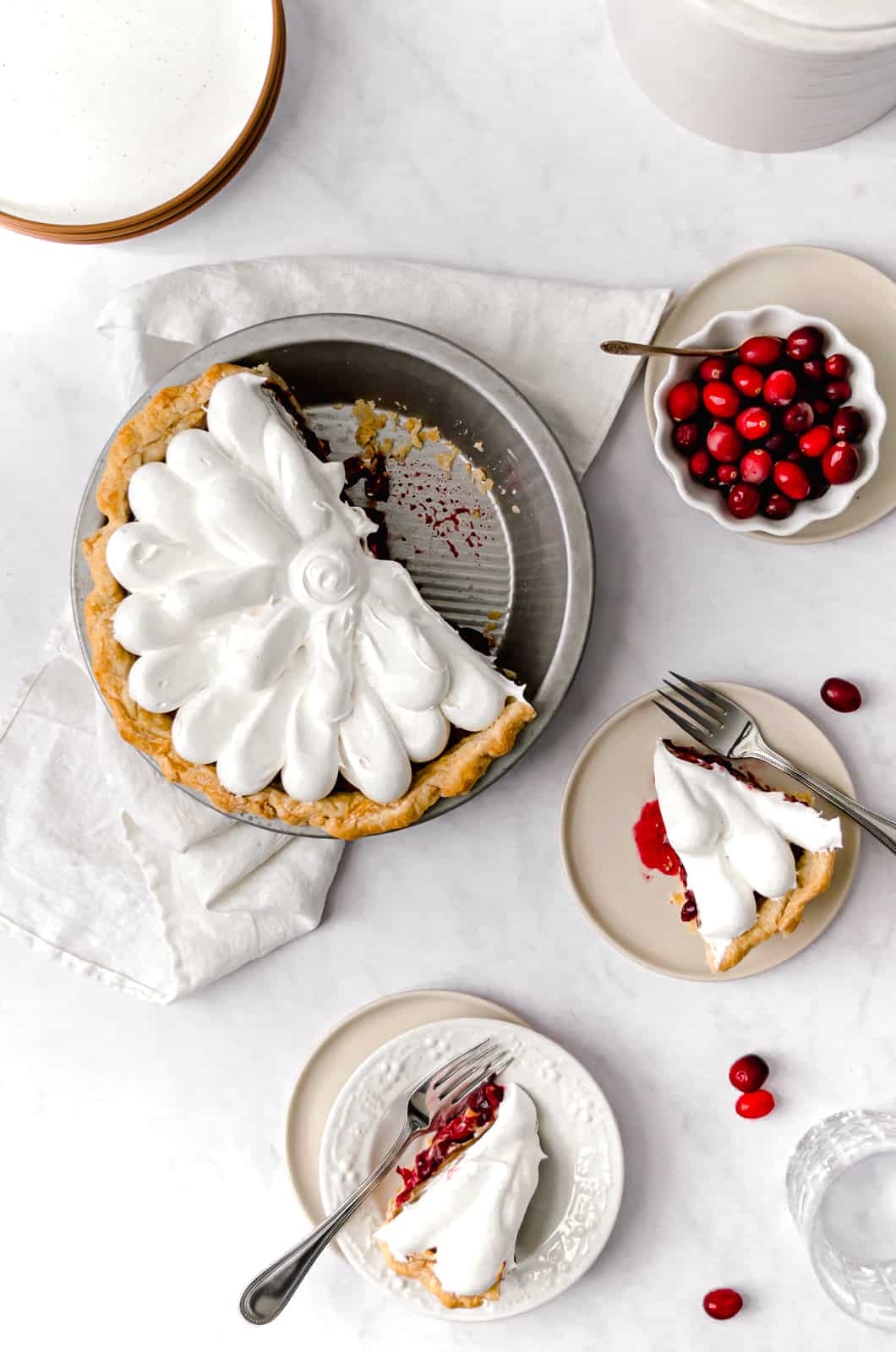 ginger molasses cranberry pie with slices of pie on plates.