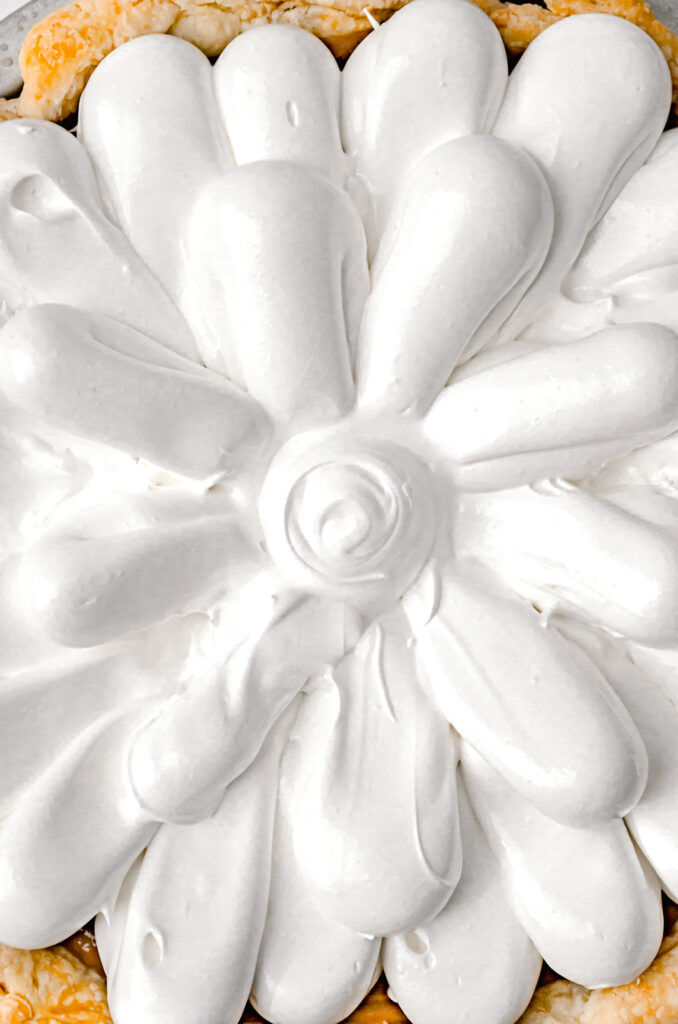 close-up of swiss meringue decorated pie