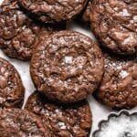 brownie cookies piled on parchment paper