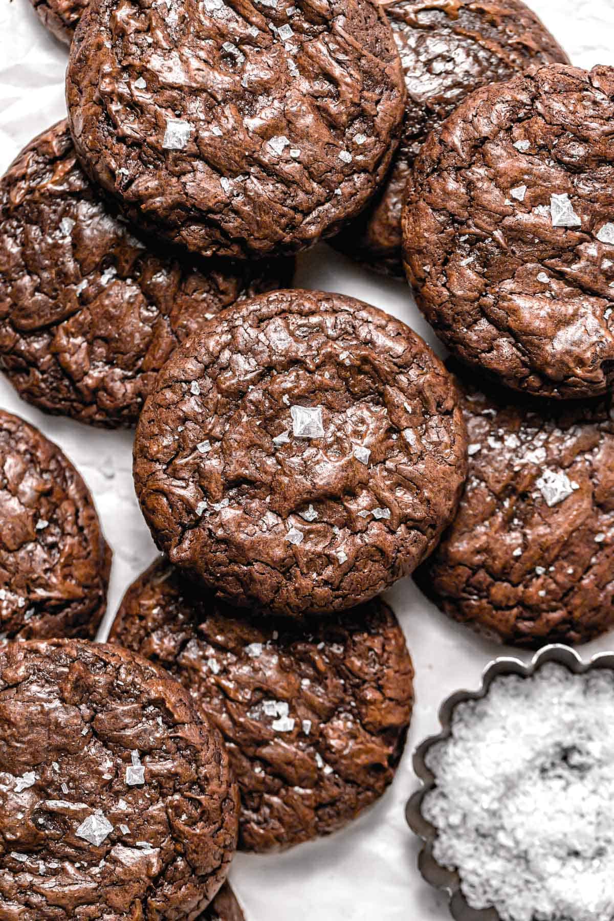 brownie cookies piled on parchment paper.