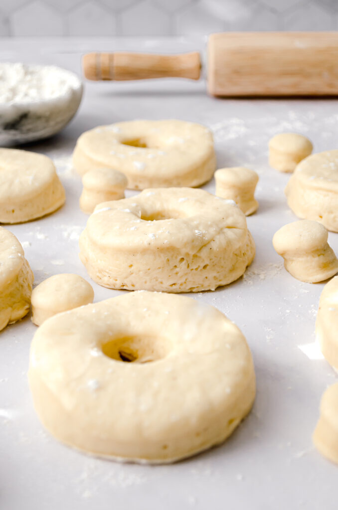 cutout brioche dough into donuts and donut holes