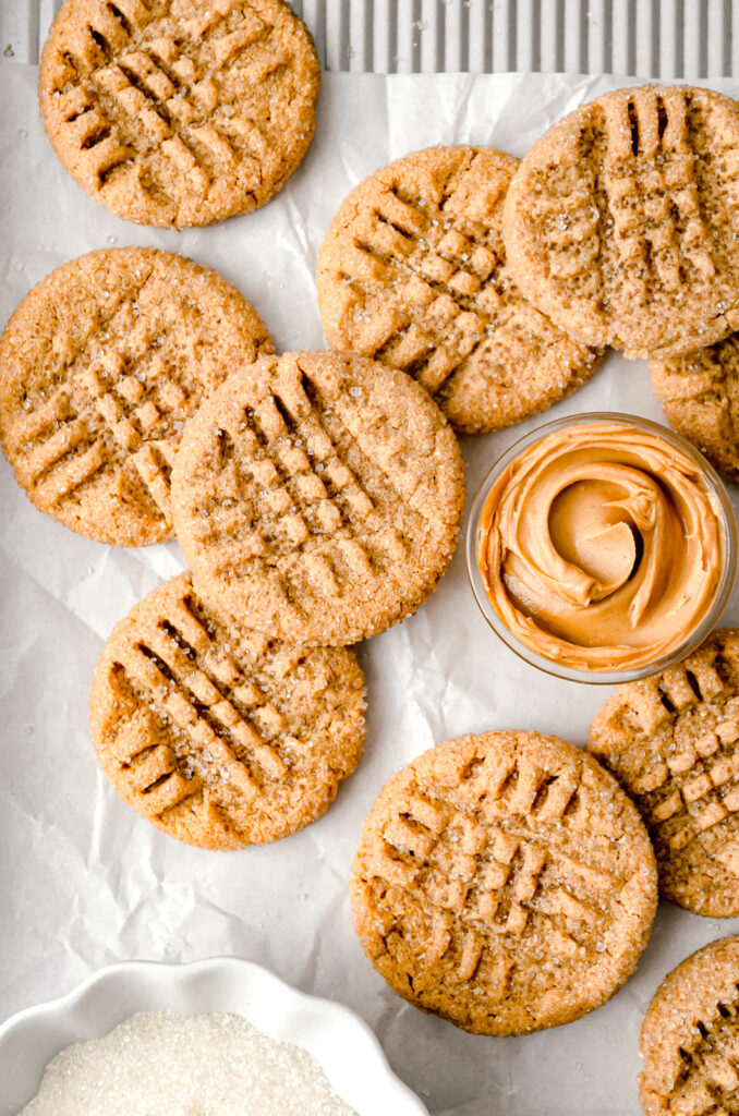 peanut butter cookies on parchment lined baking sheet