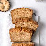 sliced brown butter banana bread on parchment paper