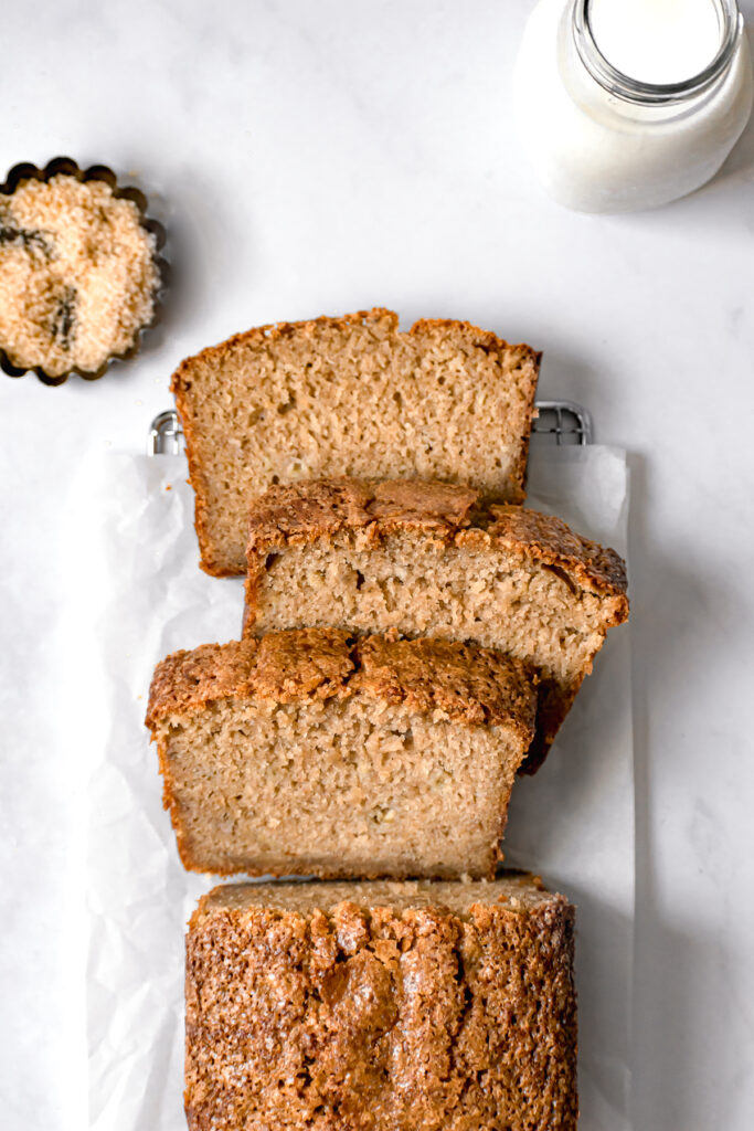 sliced brown butter banana bread on parchment paper