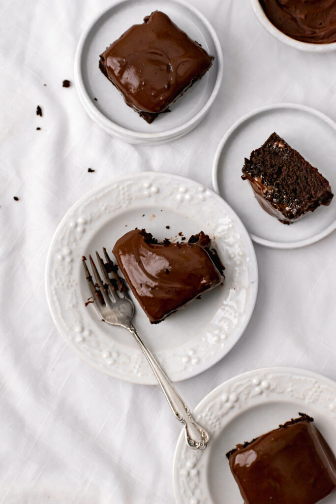 dark chocolate malt snack cake pieces on white plate