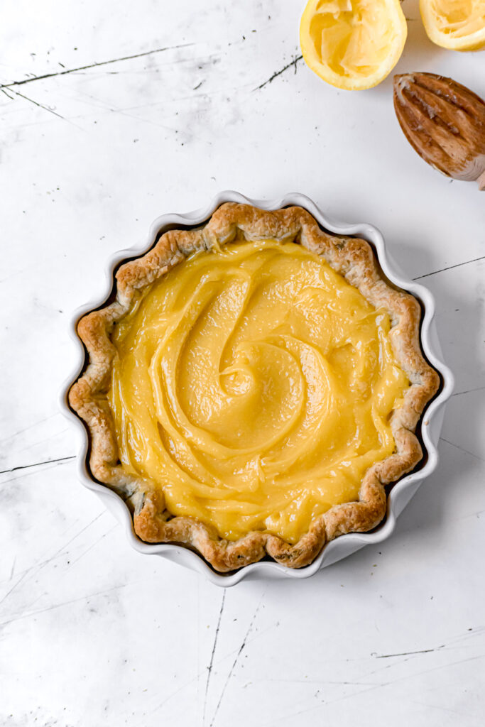 lemon pie filling spread out evenly in pie crust