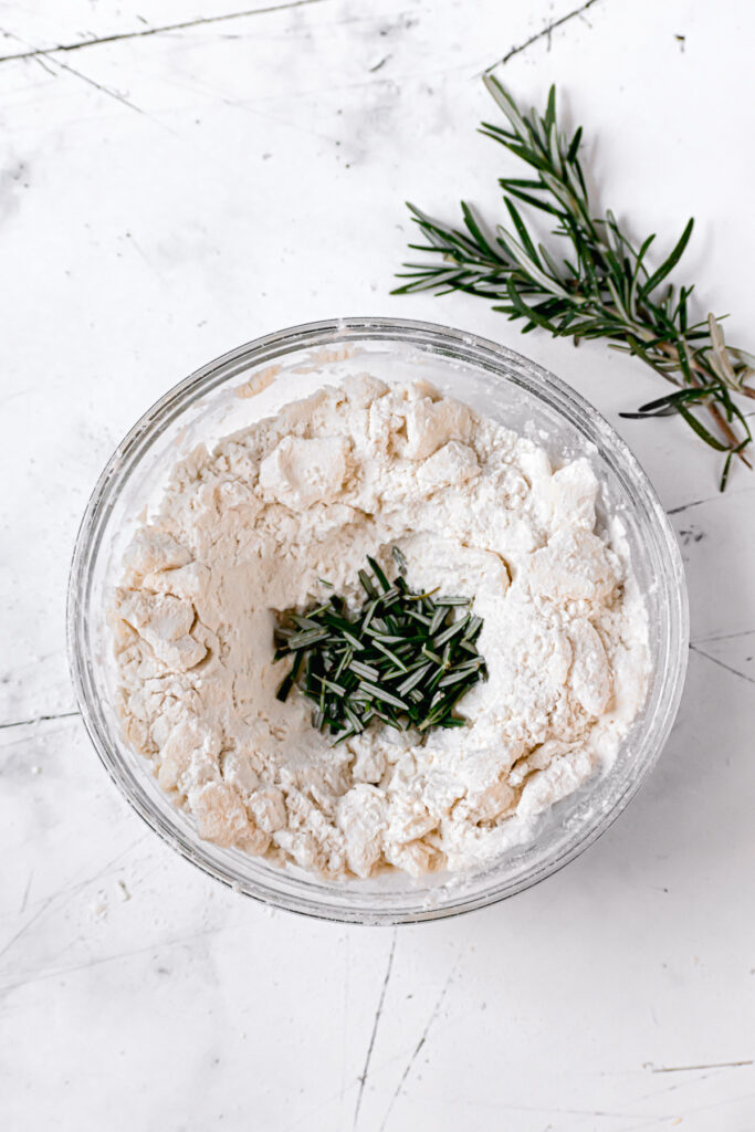 butter properly cut into the flour with rosemary in the center