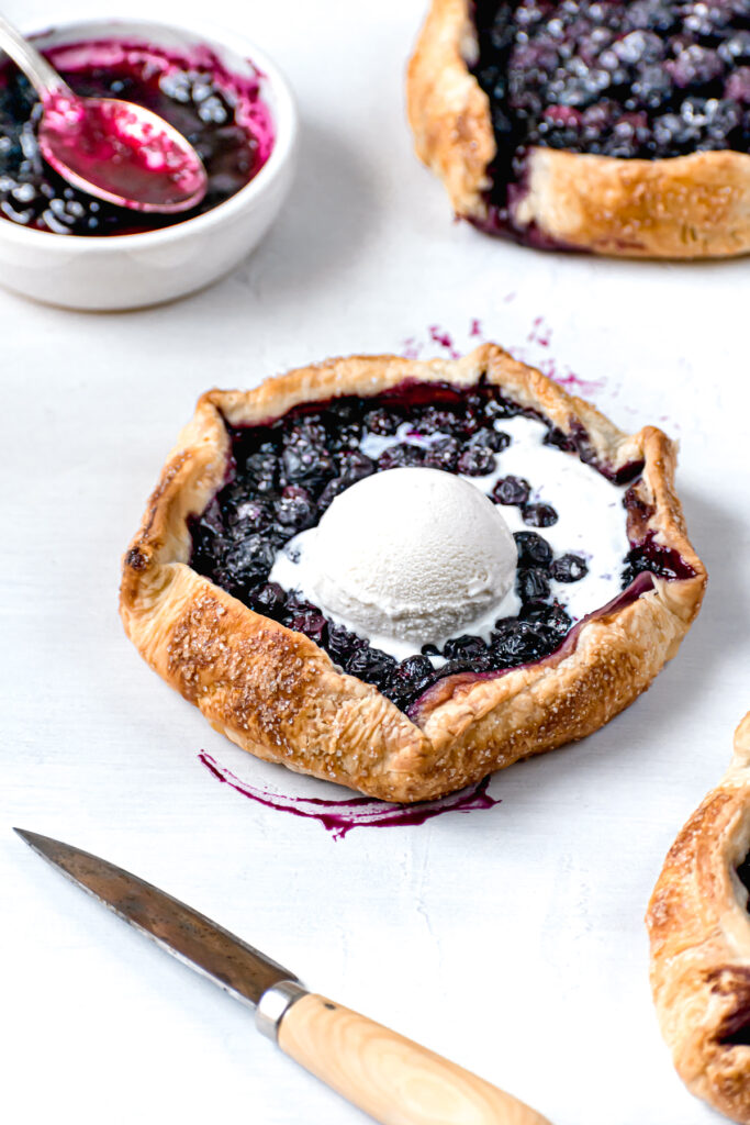 blueberry galette with scoop of vanilla ice cream on top