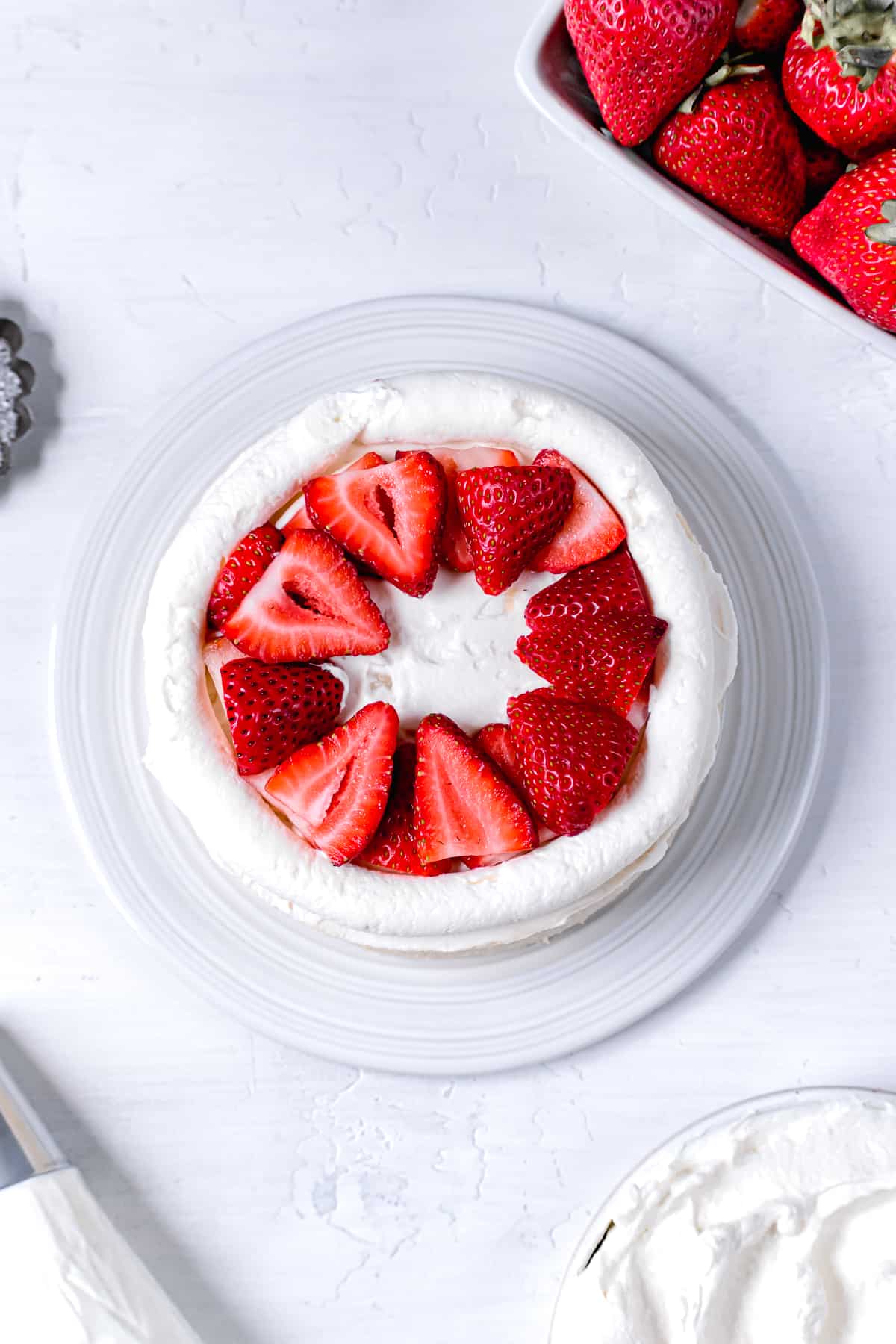 sliced strawberries layered in the middle of the cake.