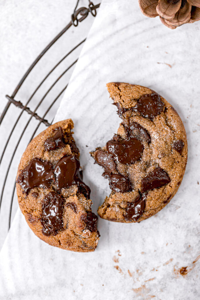 chocolate chip molasses cookie broken on parchment paper