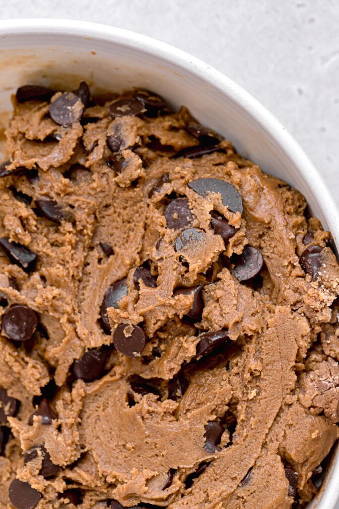 chocolate chip molasses cookie dough in white bowl
