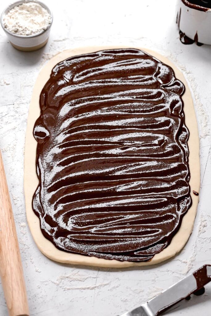 rolled out brioche dough with chocolate tahini filling