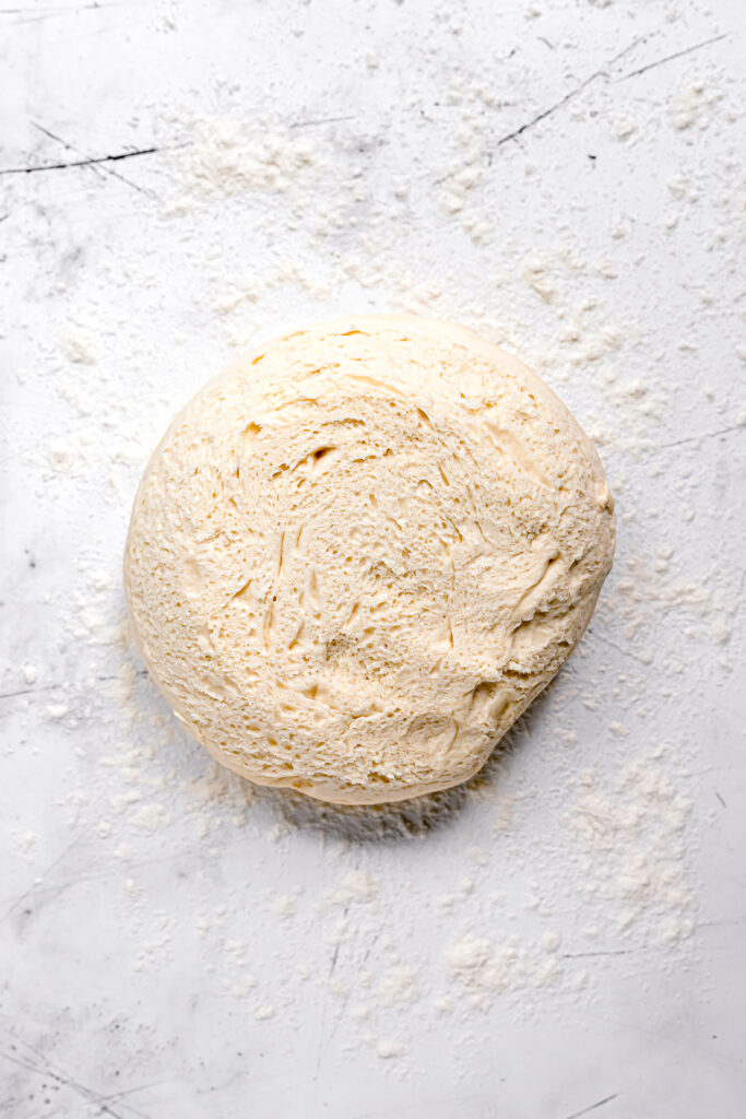brioche dough on floured surface