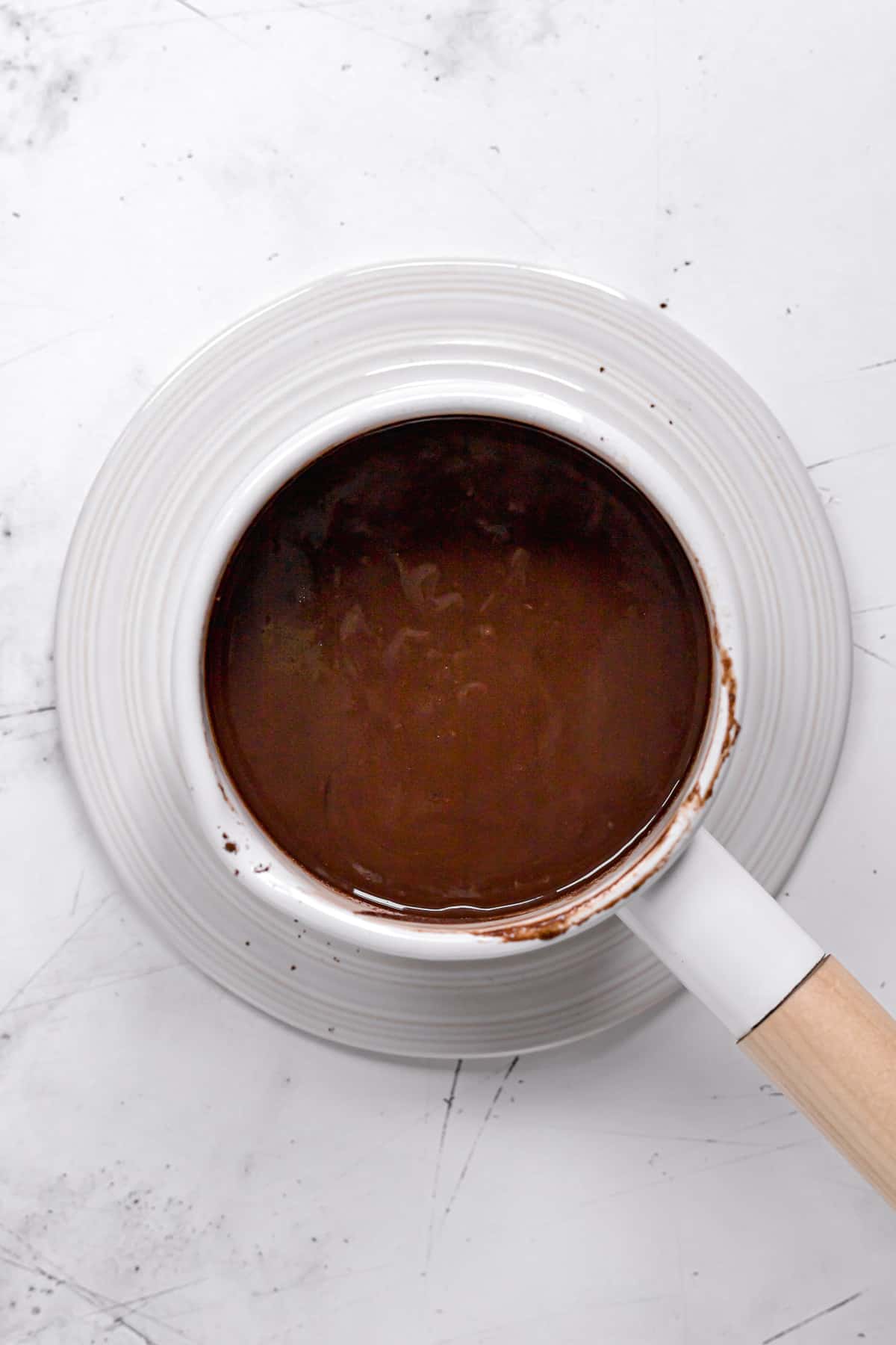 chocolate tahini filling in white saucepan.