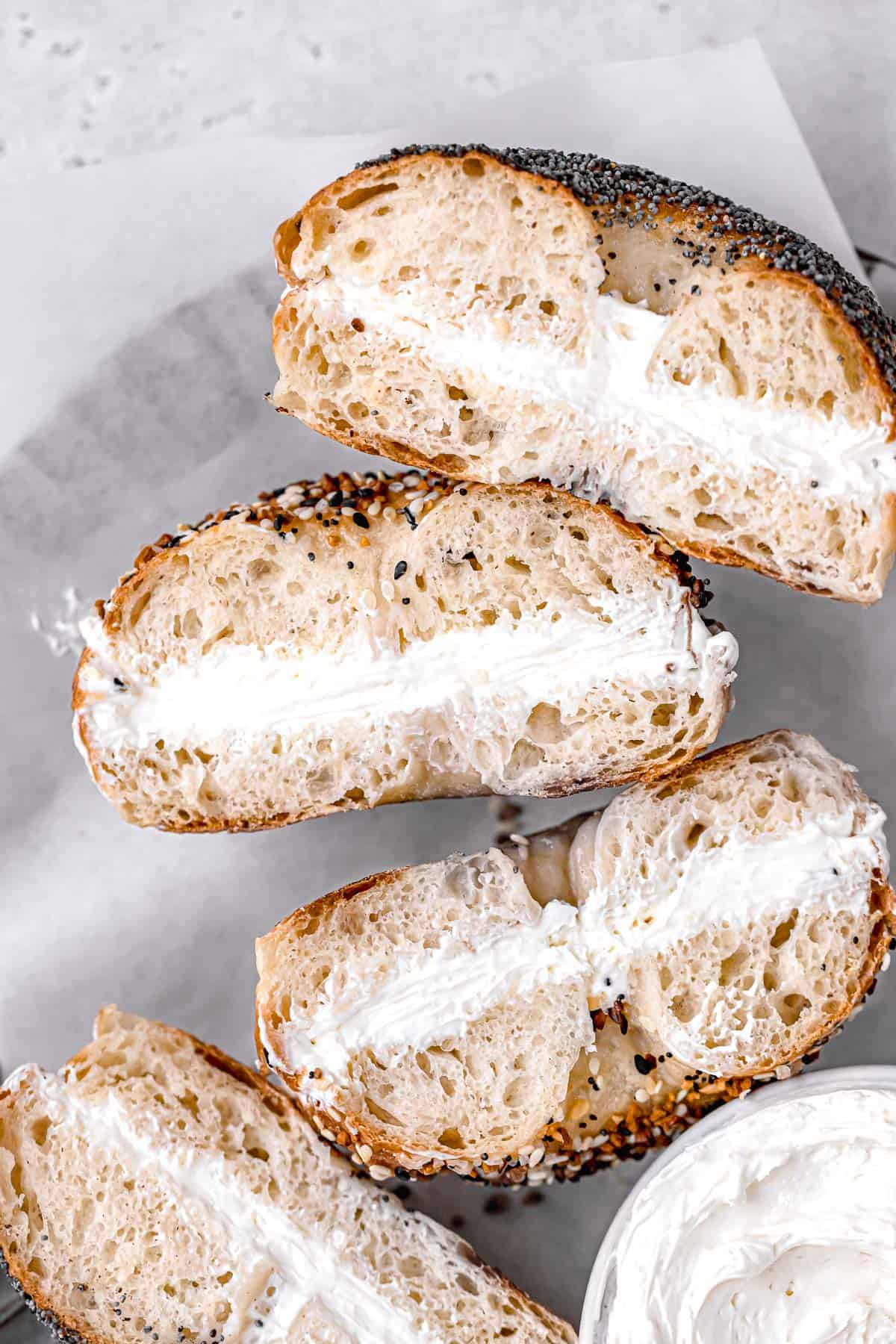 new york style bagels with cream cheese on plate.