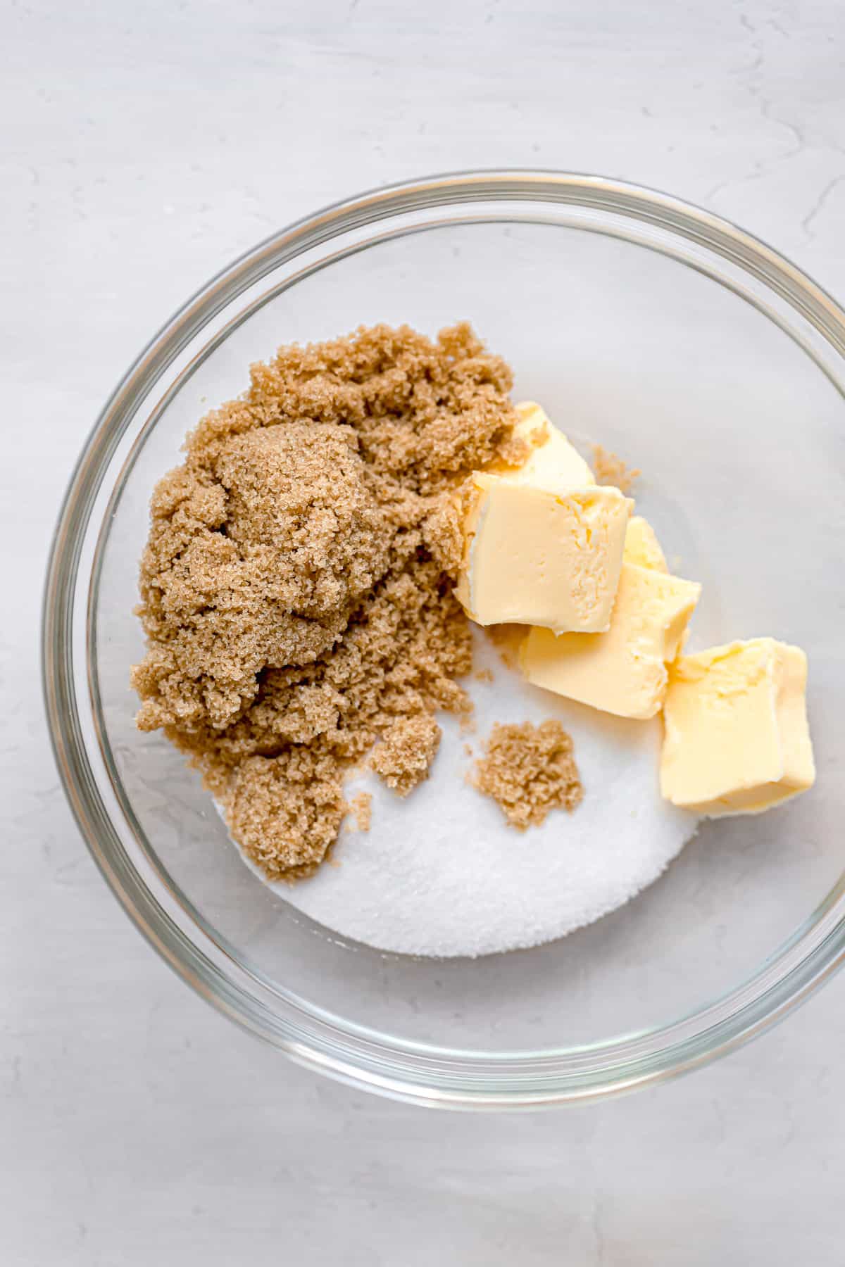 sugars and butter in glass bowl.