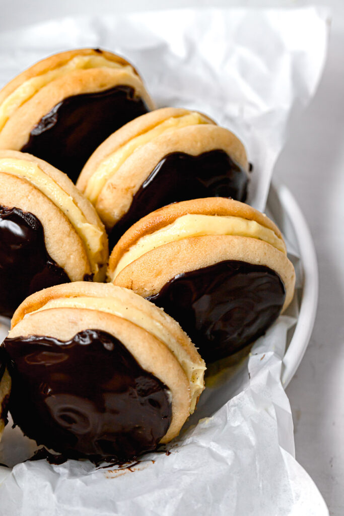 vanilla whoopie pies with pastry cream filling and chocolate ganache