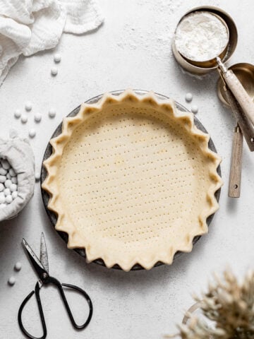 3 ingredient pie crust in metal pie pan.