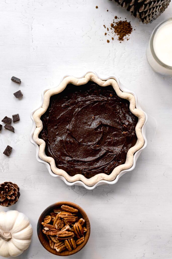 brownie batter spread into the pie crust