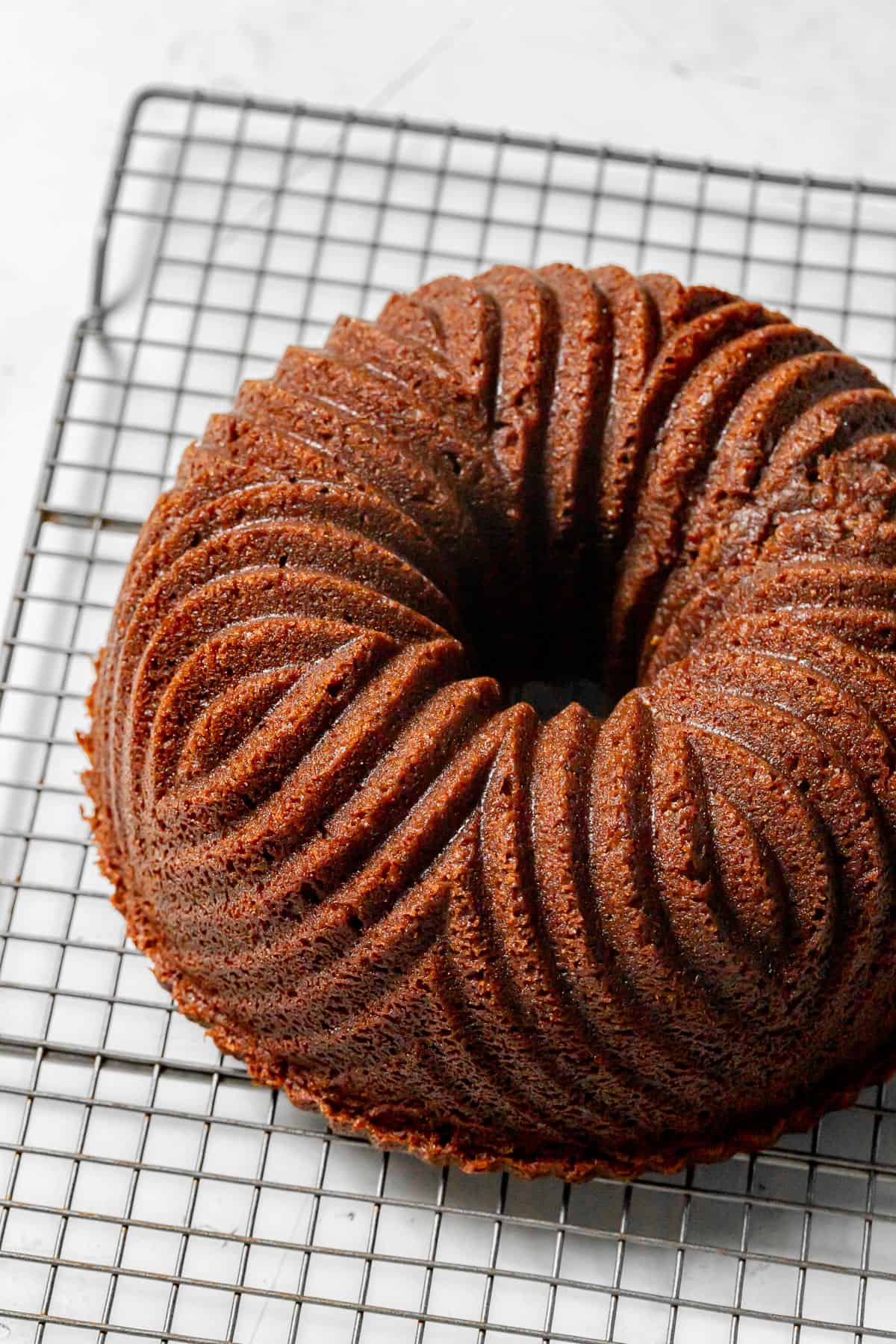 gingerbread bundt cake on wire rack.