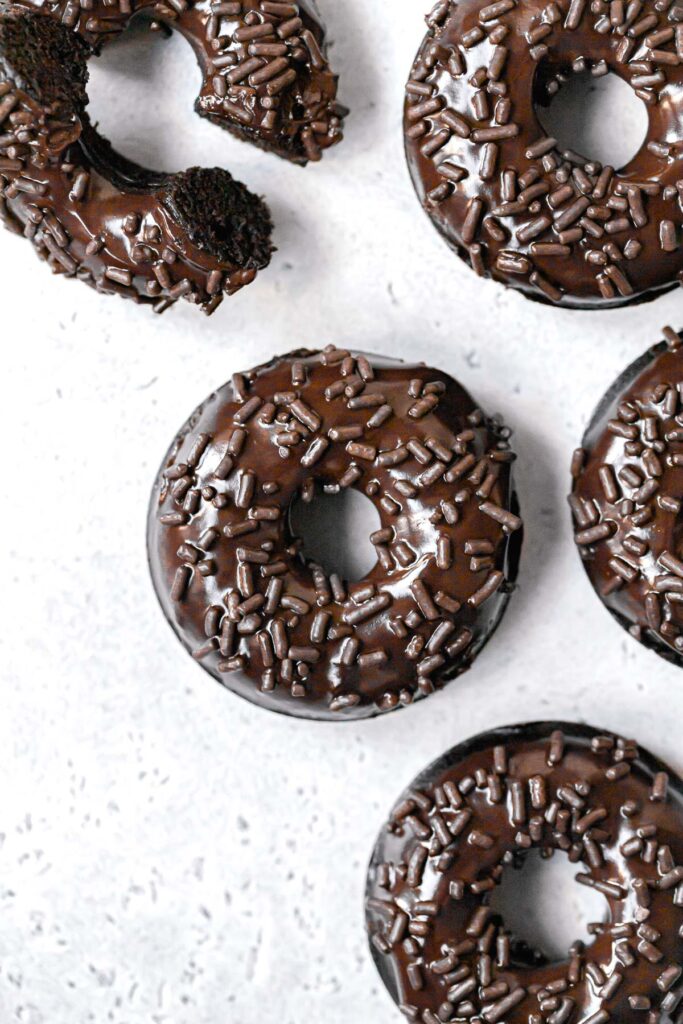 chocolate baked donuts lined up