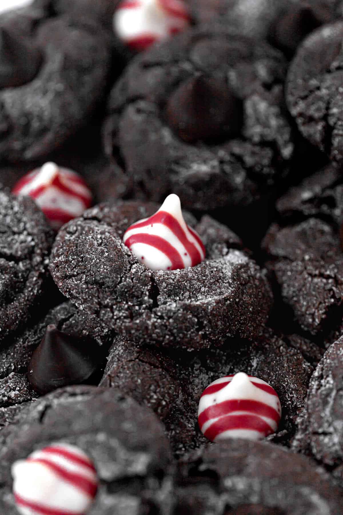 chocolate peppermint kiss cookies in a pile.