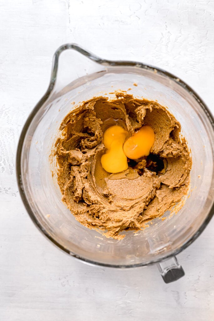 eggs and vanilla added to mixture in clear bowl