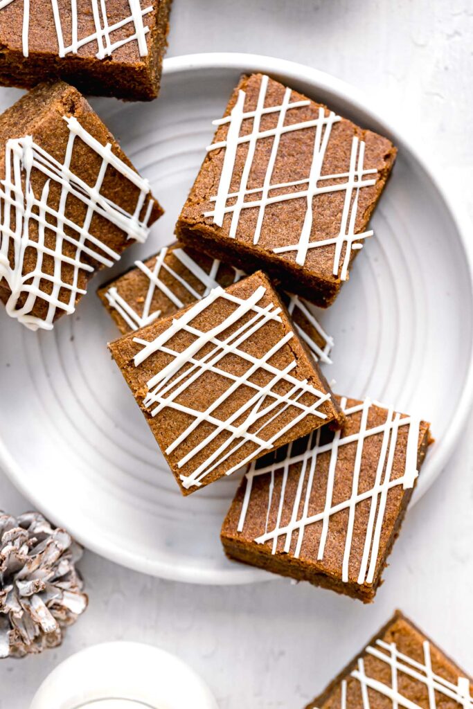 gingerbread blondies piled on white plate