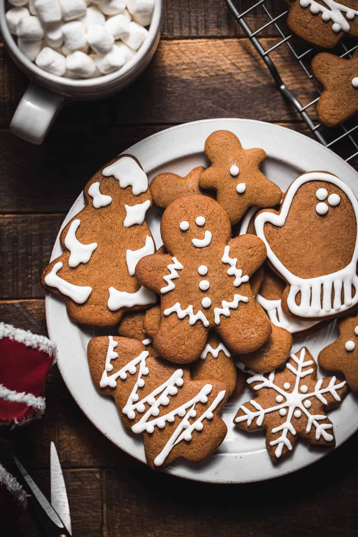 gingerbread cutout cookies on white plate.