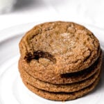 molasses cookies stacked on white plate