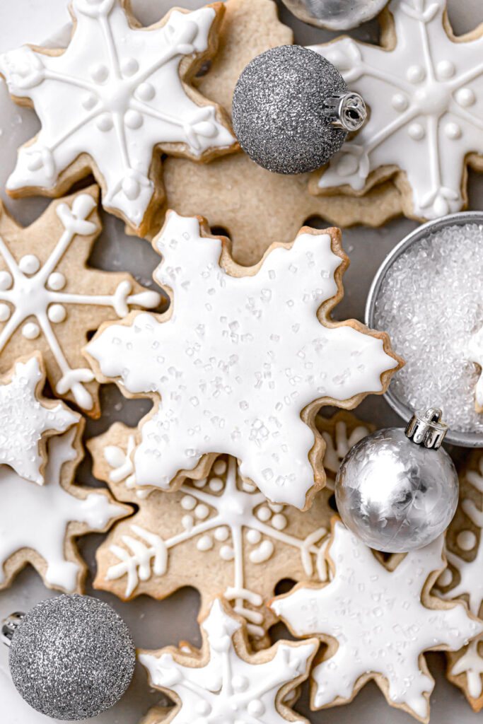 snowflake sugar cookies decorated with white royal icing