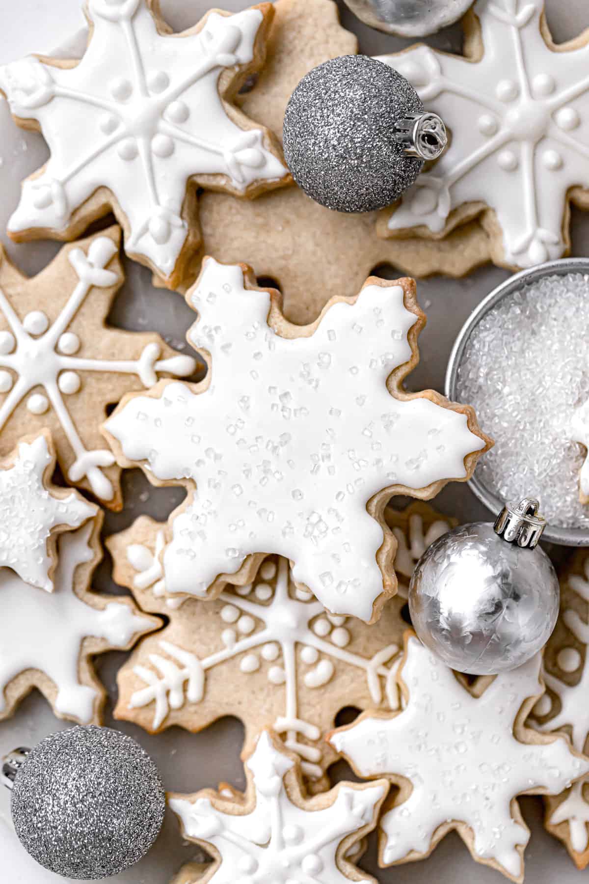 snowflake sugar cookies decorated with white royal icing.