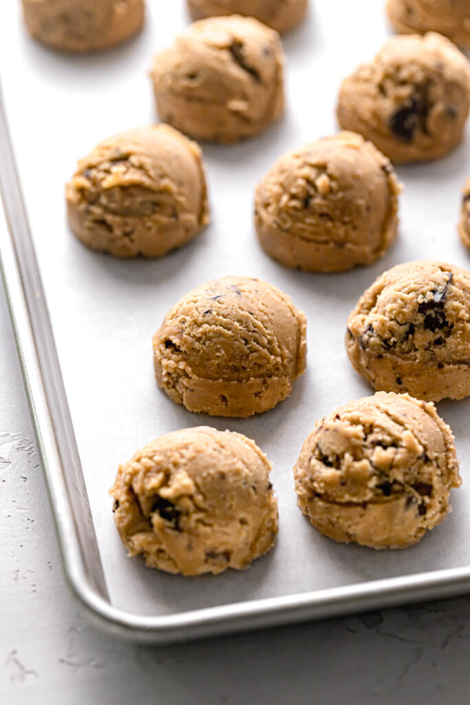 chocolate chip peanut butter cookie dough balls on baking sheet