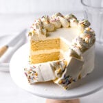 small vanilla cake recipe with swiss meringue buttercream cut to reveal interior