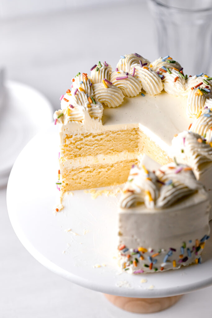 small vanilla cake recipe with swiss meringue buttercream and rainbow sprinkles