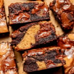 brownie blondies lined up on parchment paper.