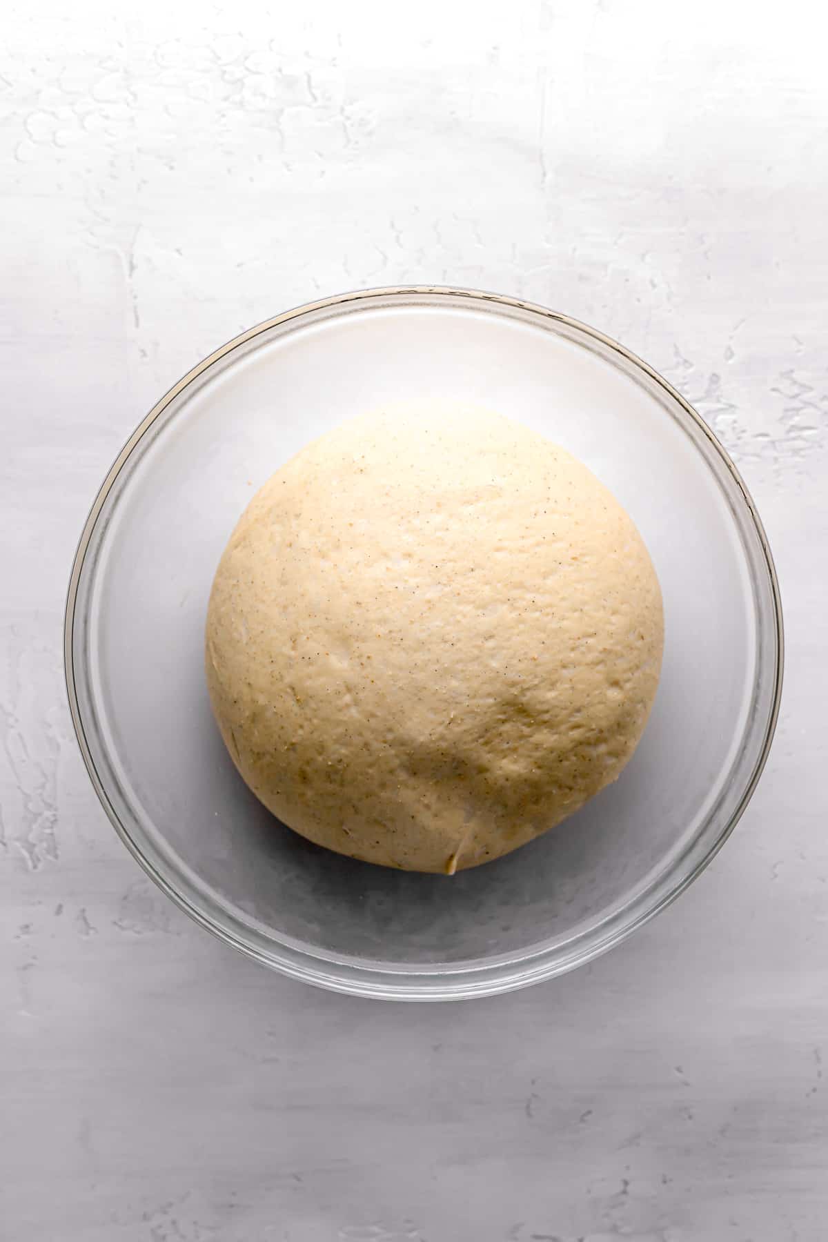 proofed dough in glass bowl.