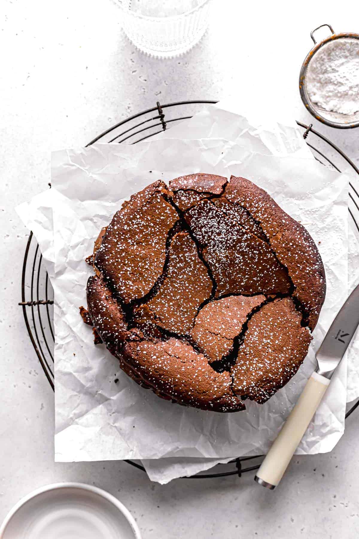 flourless chocolate cake for two with powdered sugar.